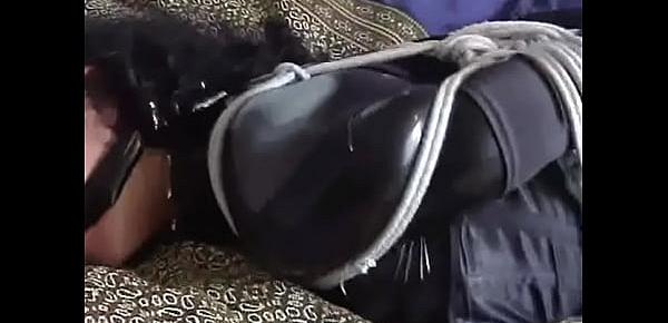  Hogtied Beauty in Corset and Latex Struggles in Bed to Use Cellphone